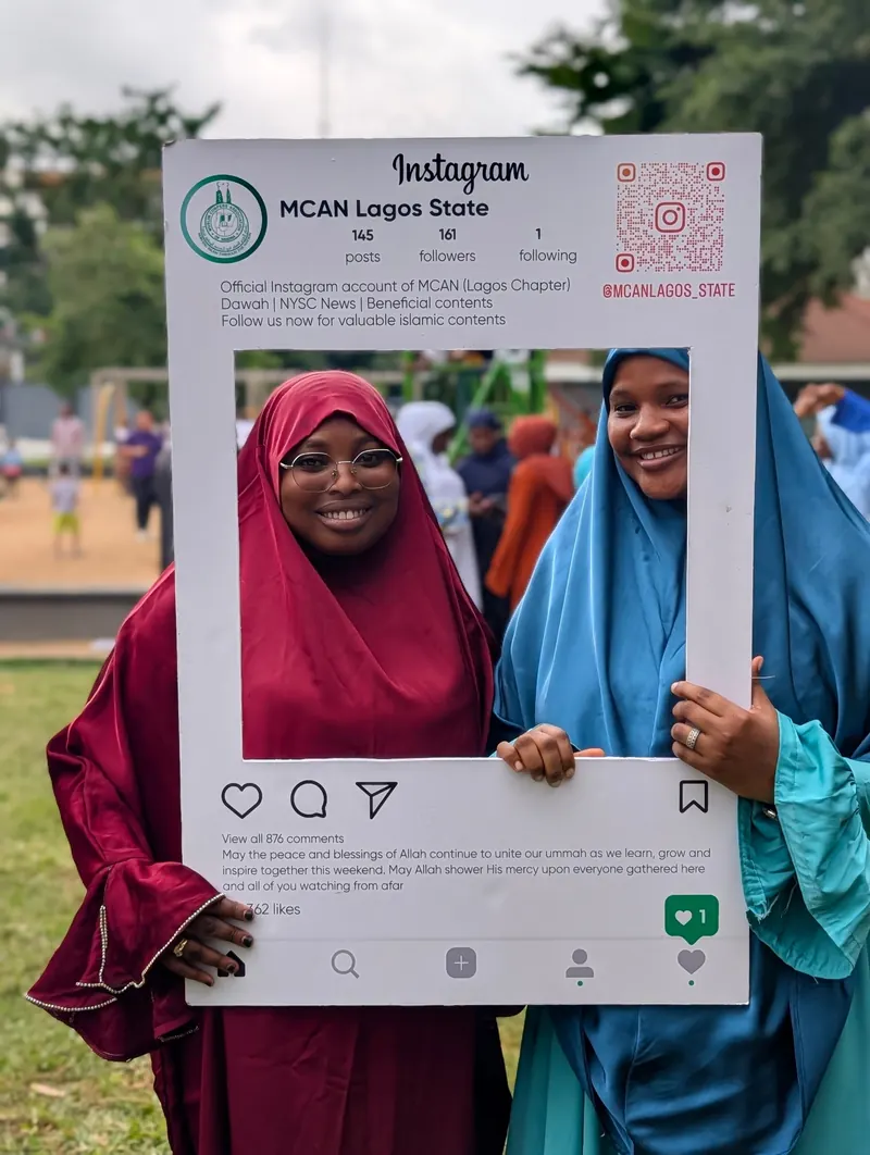 Two attendees at the MCAN Lagos photo frame