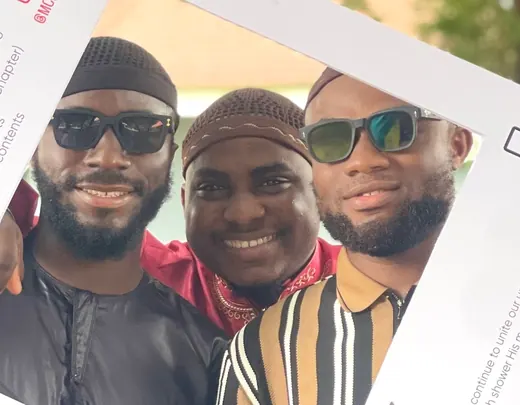 Three friends at the MCAN Lagos photo frame